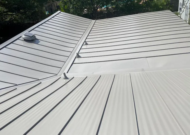 Solar attic fan installed on a metal roof for Roof Ventilation in Fort Rucker